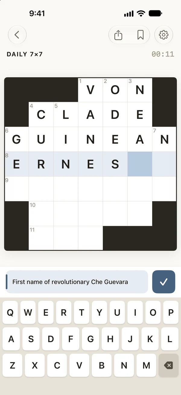 A 7×7 crossword half filled in, with the clue for the selected word above the keyboard.